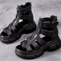 Kenike female leather platform sandals with hollow-out design and retro style, featuring open toe and ankle strap.