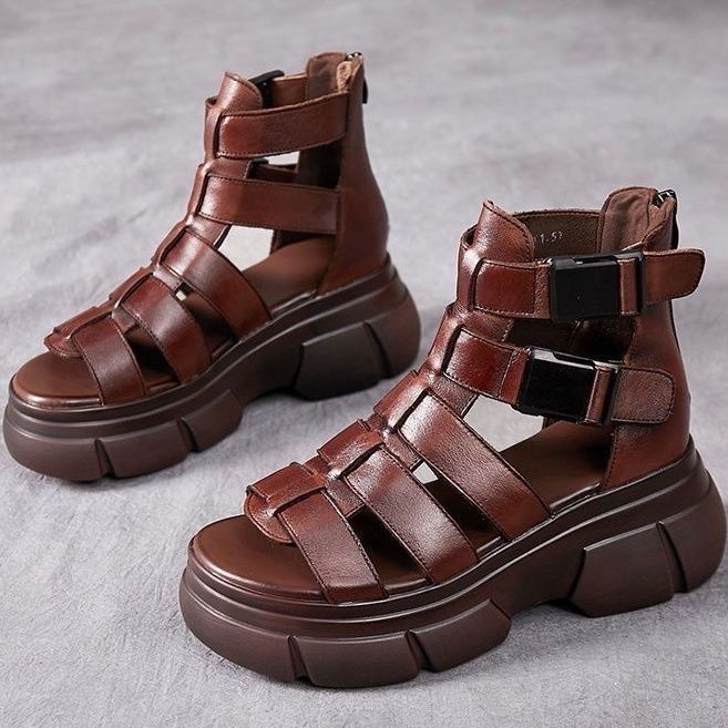 Kenike female leather hollow-out platform sandals with retro style, open-toe design and adjustable ankle strap for women.