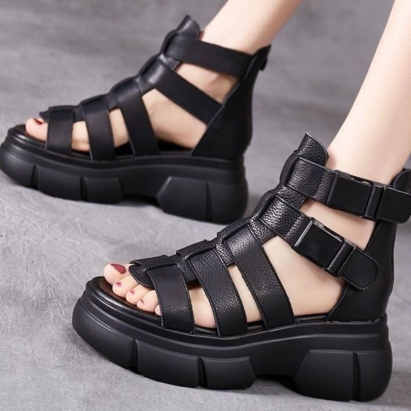 Kenike female leather hollow-out platform sandals with retro style, open toe design, and stylish ankle straps.