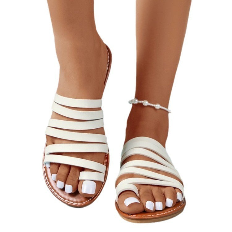 Women's solid color flat sandals by Kenike, casual slip-on footwear featuring simple, comfortable design for everyday wear.