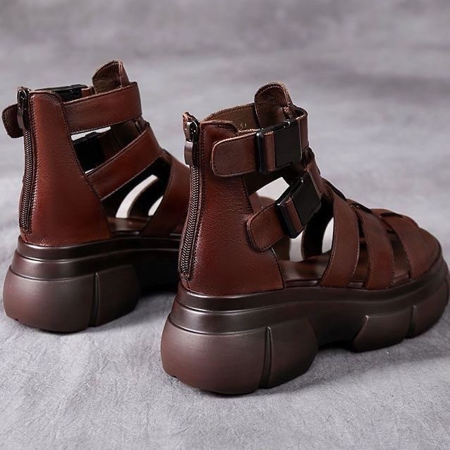 Kenike female leather hollow-out platform sandals with retro style and stylish design, featuring open-toe and ankle strap details.
